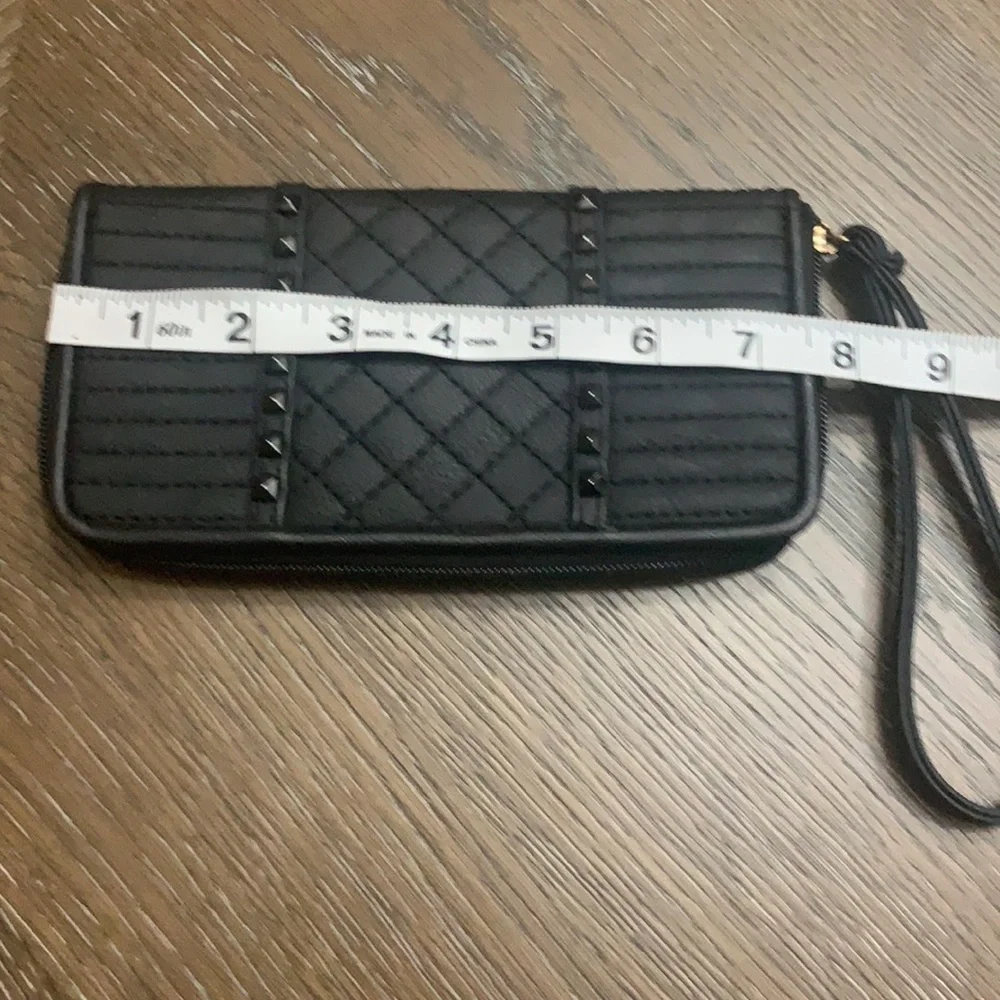 Unbranded black with black brads wristlets